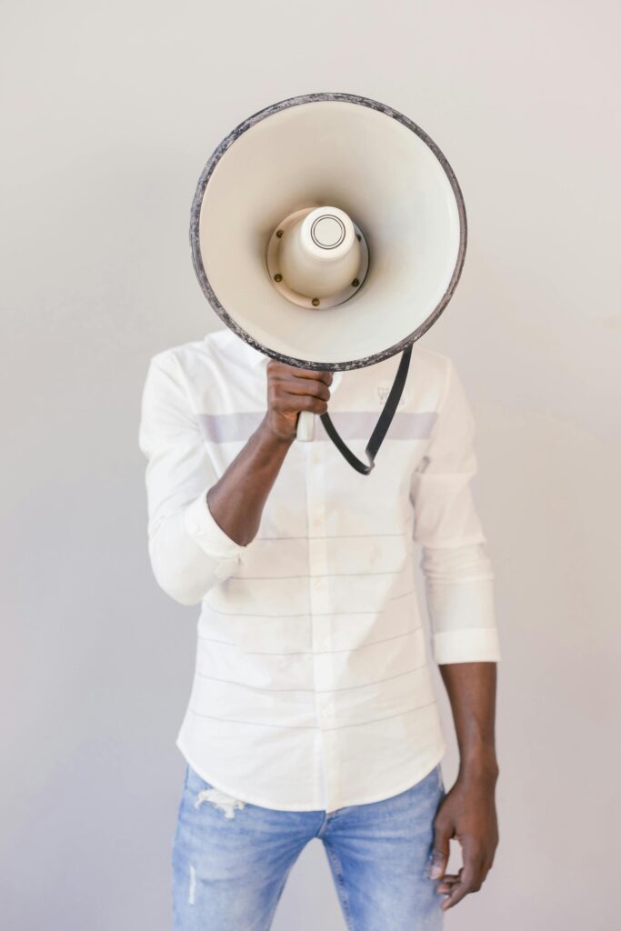 Man facing camera with megaphone.