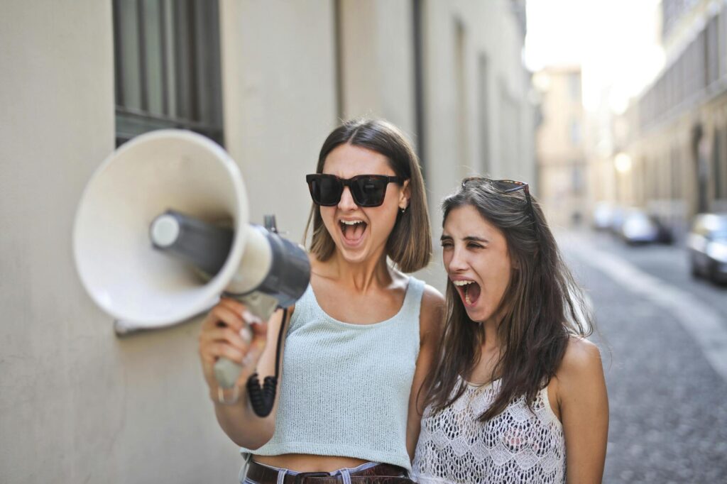 2 girls with megaphone